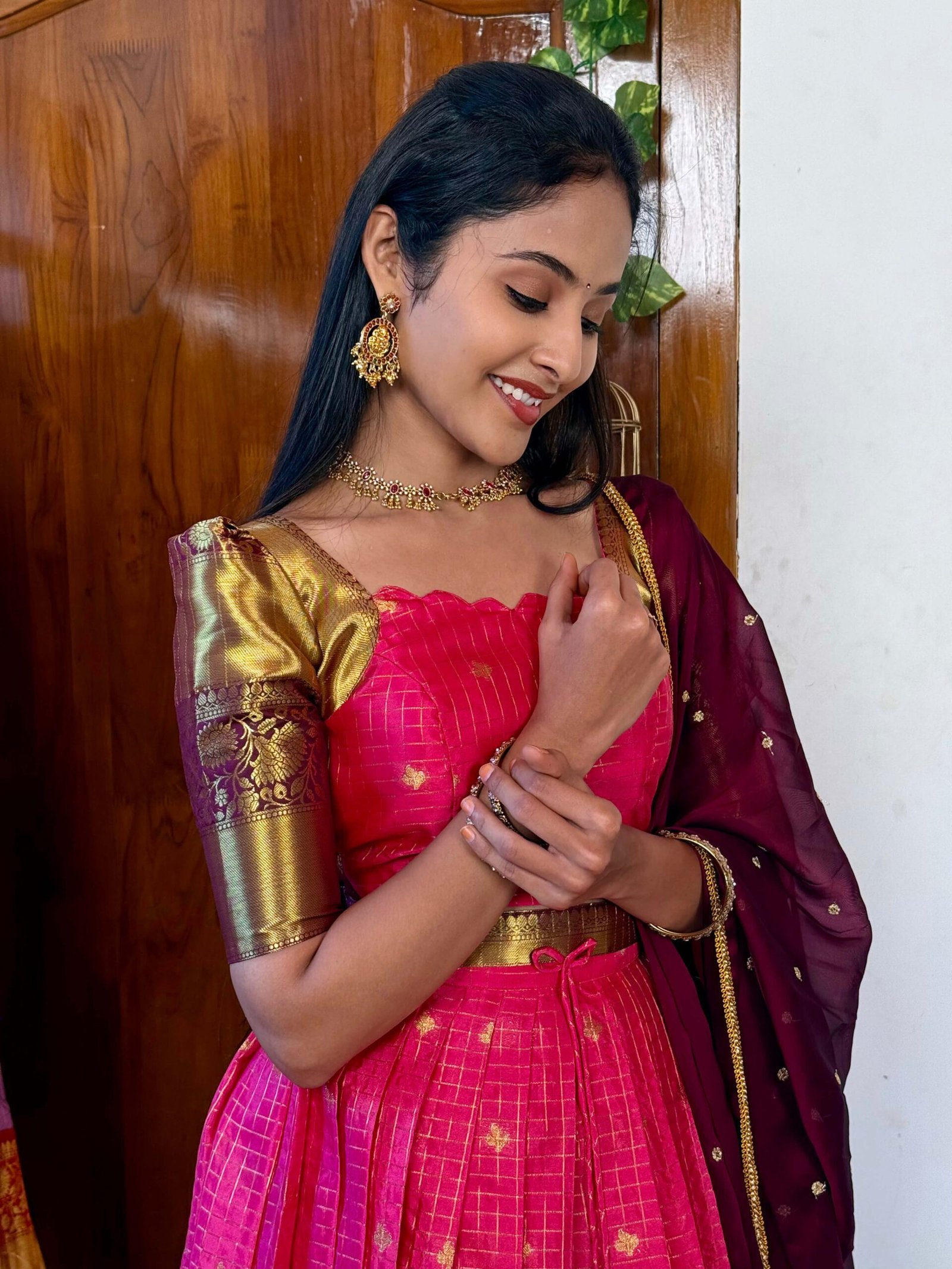 Kanmani Rani pink and dark wine lehenga