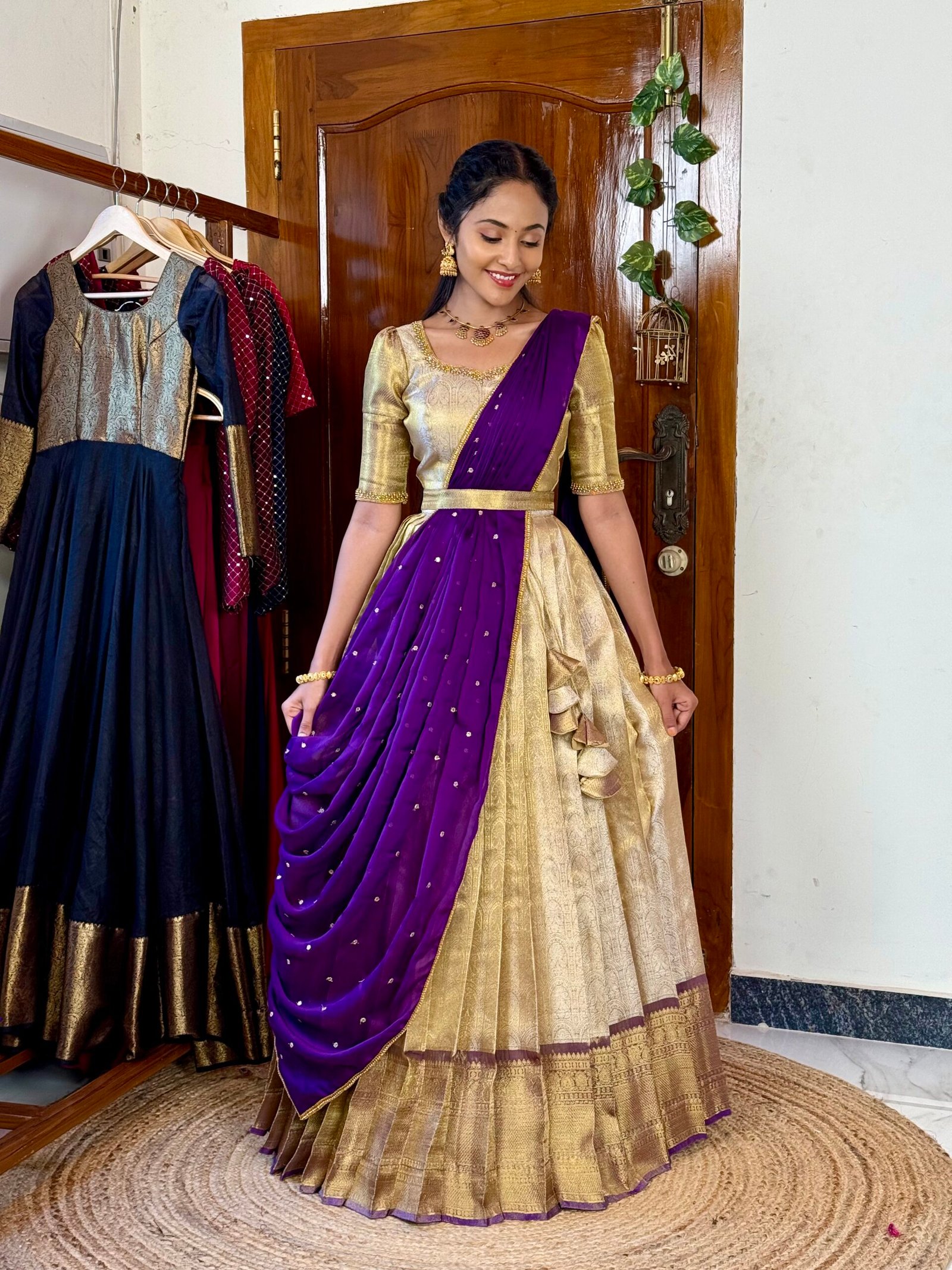 Madhuram off white and purple hand worked lehenga set